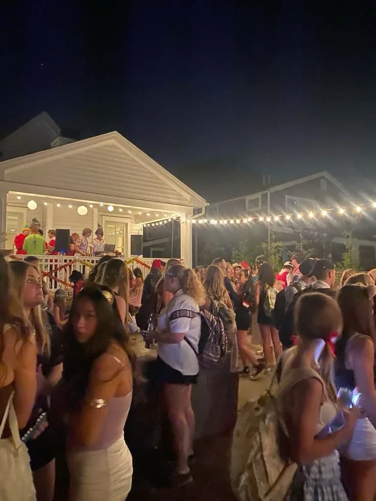 People gathering outside at a house party